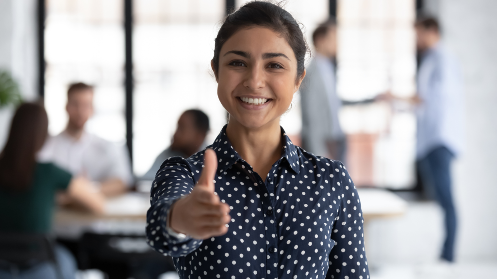 Woman extending her hand and smiling
